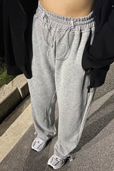 Pantalon de sport à poches obliques et cordon de serrage à la taille