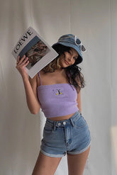 Short en jean à poches obliques et double bouton