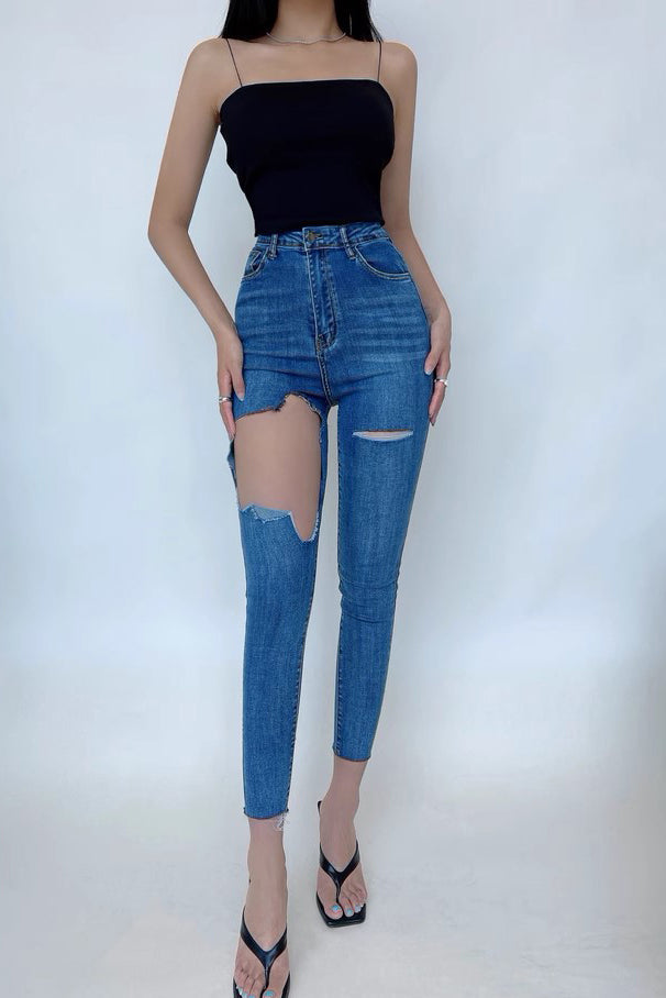 Sexy, enge Jeans mit Wickeldesign und hoher Taille sowie großen Löchern