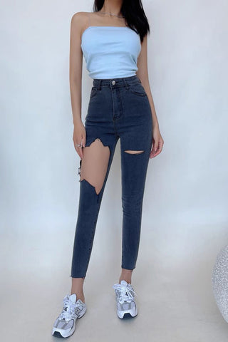 Sexy, enge Jeans mit Wickeldesign und hoher Taille sowie großen Löchern