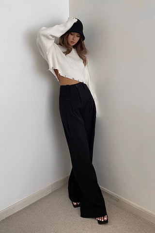 Pantalon à jambes larges et poches obliques